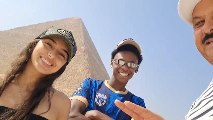 Travelers at the Great Sphinx and Pyramids of Giza