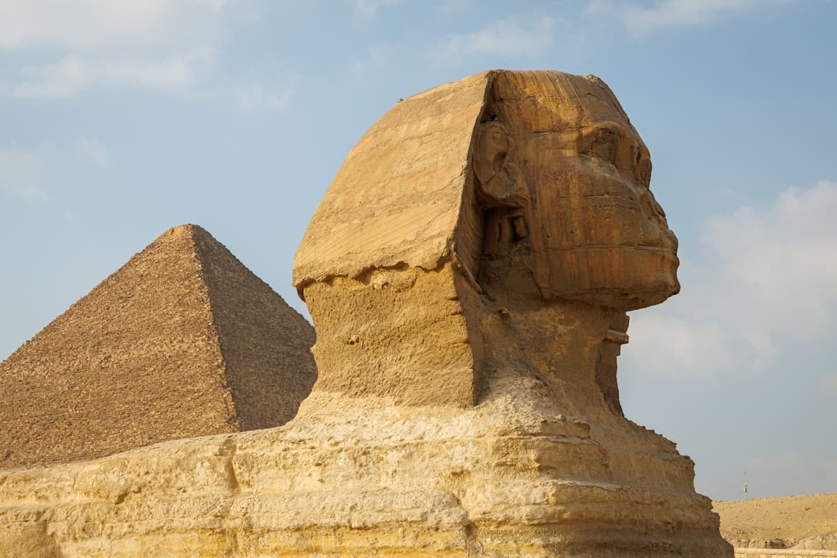 The Great Sphinx and the Pyramids of Giza at golden hour